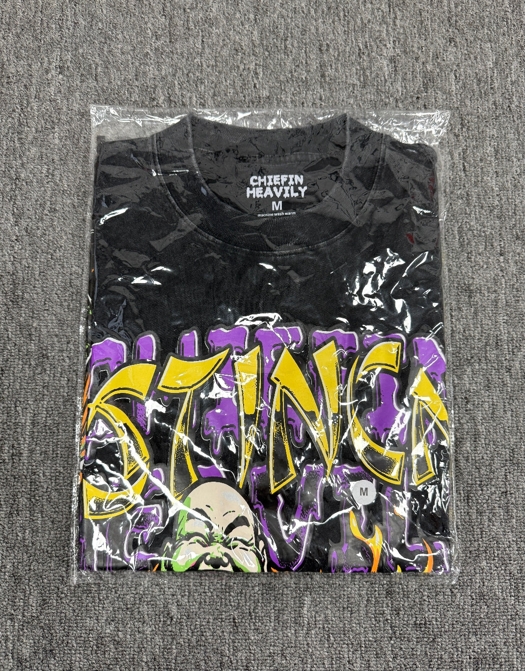 vintage-style graphic t- shirt featuring a cartoon Buddha and a cat